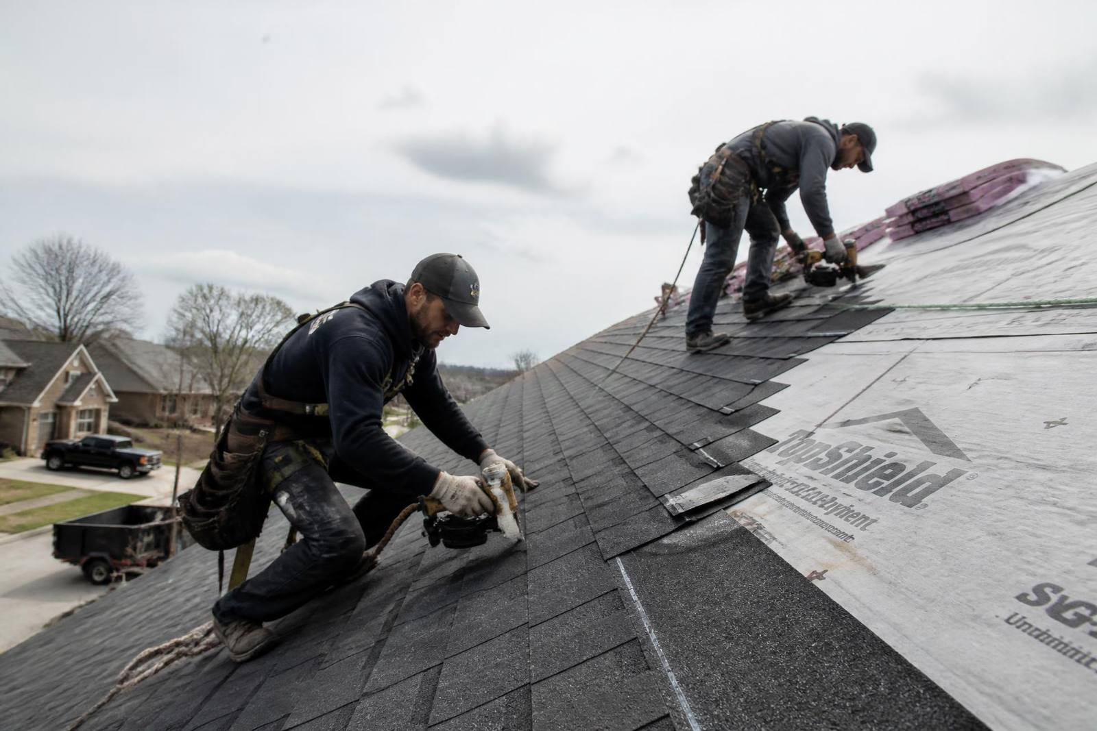 Alfa Y Omega crew installing shingles on an Omaha-area roof